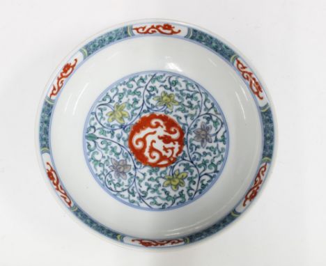 Chinese dish decorated in Doucai five coloured enamels, bearing a Kangxi mark to the base but likely later,  20cm diameter 