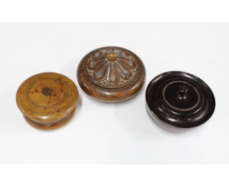 Treen shaving soap pot, the lid with internal mirror, together with an ebony lidded pot and an oak box with floral carved cov