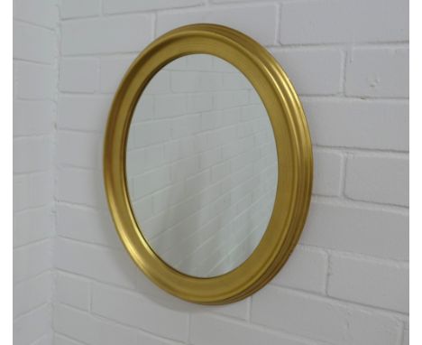 Circular gilt framed oval wall mirror, 39 x 48cm. 