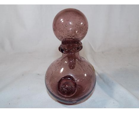 A French Biot hand blown bulbous glass decanter, aubergine colour, engraved to the base Biot, approx 15.5 cm (h)