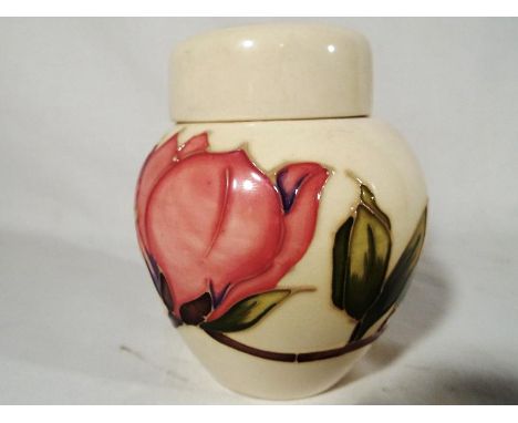 A Moorcroft Pottery lidded ginger jar decorated with pink magnolia on an ivorine ground, 11.5 (h) - Est £50 - £80