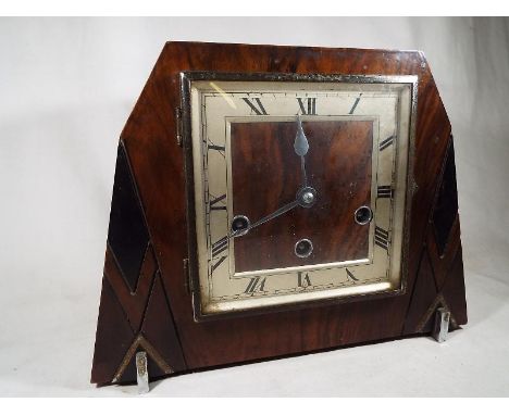 A mahogany cased art deco mantle clock, Roman numerals, Westminster chimes, movement by Haller with pendulum and key, Estimat