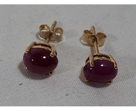 A pair of lady's 9ct gold ruby Cabochon earrings stamped 375