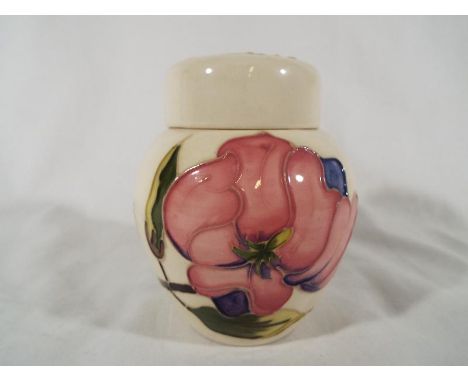 A Moorcroft Pottery lidded ginger jar decorated with pink magnolia on an ivorine ground, 11.5 (h) - Est £50 - £80