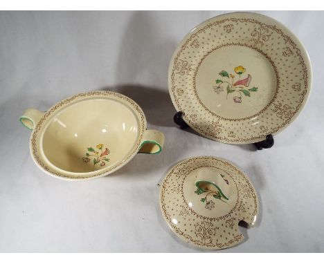 A Clarice Cliff lidded tureen and a medium sized plate of a similar design, A J Wilkinson Ltd 