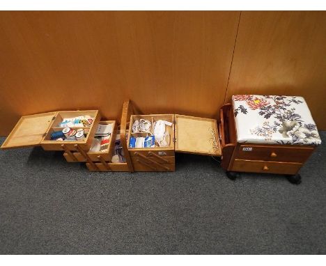A vintage wooden cantilever sewing box with contents and a further sewing on castors (2)