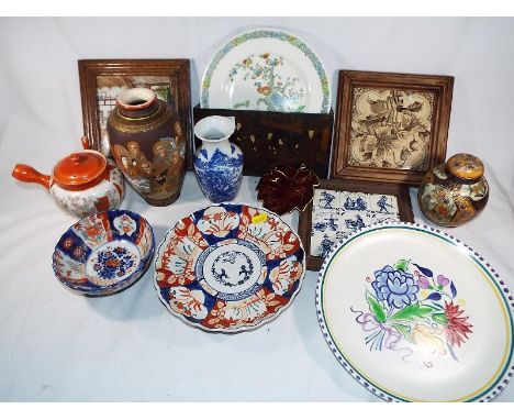 A good mixed lot to include a collection of Asian ceramics, three ceramic framed wall tiles, a wall hanging Asian letter rack