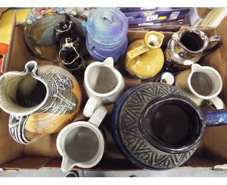 A good mixed lot of ceramic jugs to include a stoneware K.Kennedy and Co, West German and similar