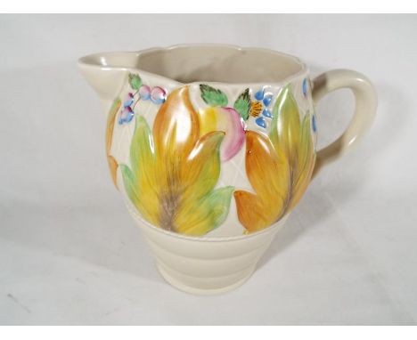 A Clarice Cliff large water jug with moulded foliate decoration to the body shape No.41A, factory marks to the base, 19cm (h)