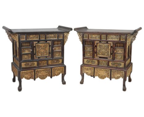 Two 19th century Chinese carved bone and wood cabinets,
each bearing two doors and two drawers in the front. The flat top sla
