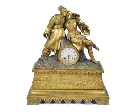 A 19th century French chinoiserie mantel clock: ormolu case, depicting a stylised Chinese couple dressed in finery, drinking 