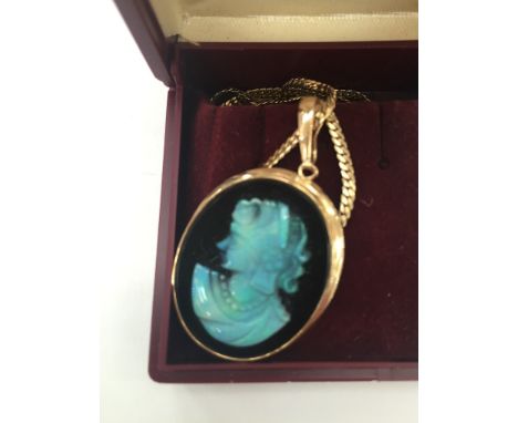 A 14ct black opal cameo