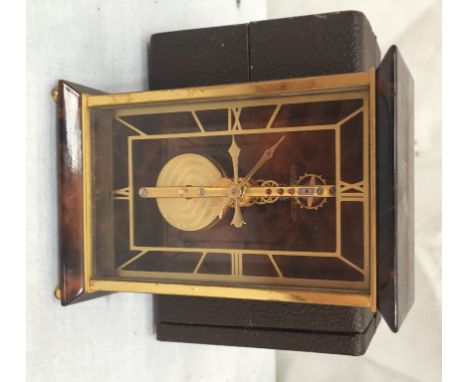 A Jaeger le Coultre clock with escapement movement in a brown case (with paperwork)