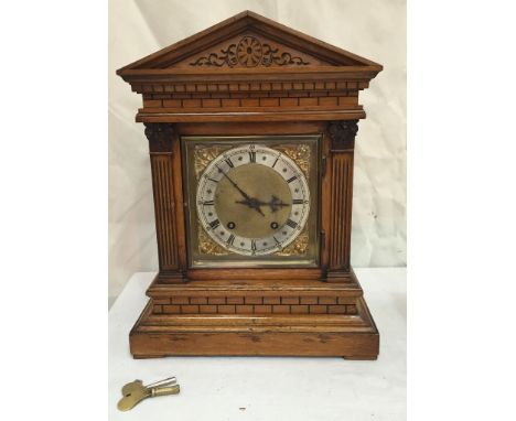 An early 20th century oak mantel clock with German movement