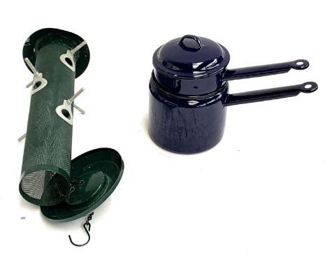 An enamel pan together with a bird feeder 