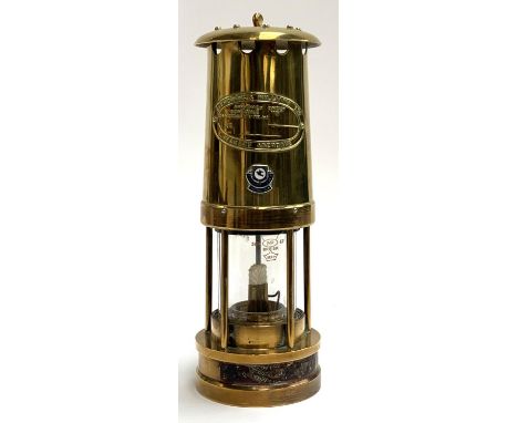 A brass miner's lamp by E Thomas &amp; Williams Ltd, bearing applied enamel badge for Cardiff City FC 