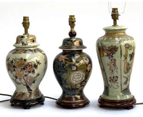 Three Chinese ceramic table lamps on hardwood stands, heightened in gilt, the tallest 44cmH to top of fitting 