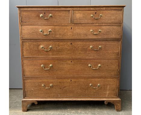 A George III oak chest, two short over four graduating drawers, on bracket feet, 108x52x114cmH 