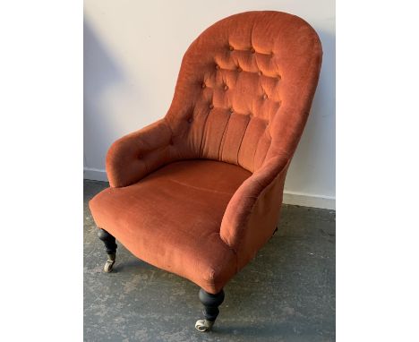 A Victorian button back bedroom chair, on ebonised turned legs and ceramic casters, 63cmW 