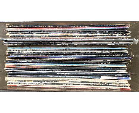 A mixed box of vinyl LPs to include Michael Jackson, Madness, Rod Stewart, NOW 2, Simon and Garfunkel, Leo Sayer, Walt Disney