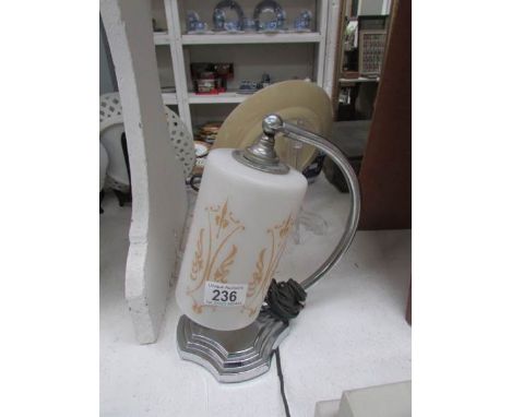 An Art Deco chrome table lamp with shade