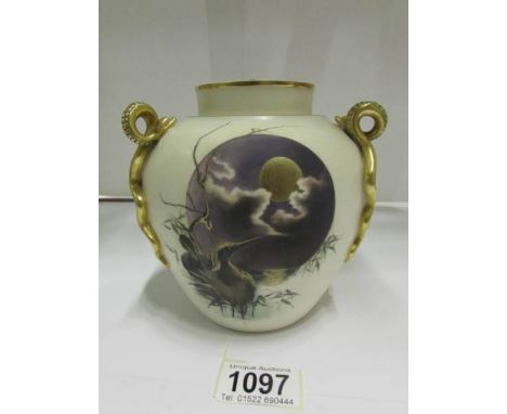 A Royal Worcester lidded vase with bird and serpent decoration