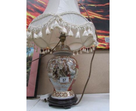 An Oriental style table lamp with shade