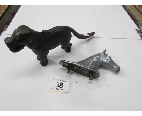 A dog nutcracker and a horse head car mascot