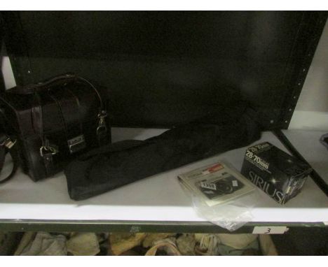 A Pentax K100 camera with lens, tripod and case