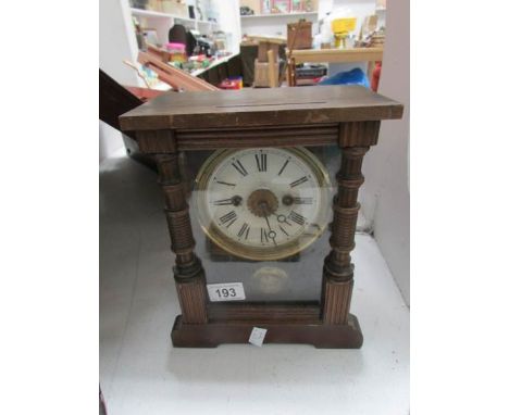 A mantel clock with drop pendelum