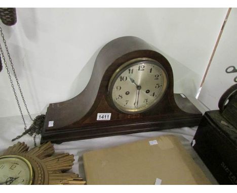 A mahogany inlaid mantel clock (key and pendelum in office)