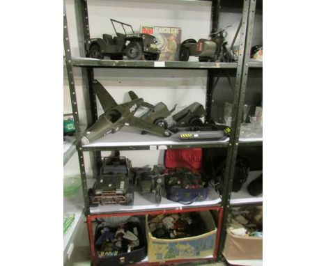 A quantity of Action man toys, uniforms and other related items (4 shelves)