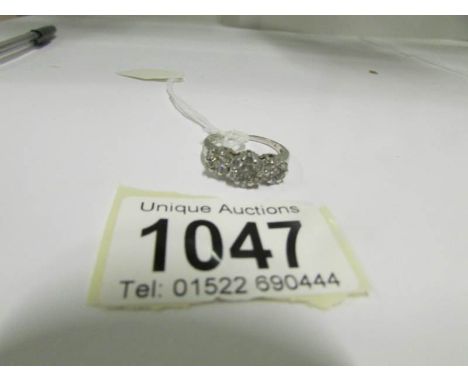 A 14kt white gold 1 carat and 3 floral diamond ring, size R
