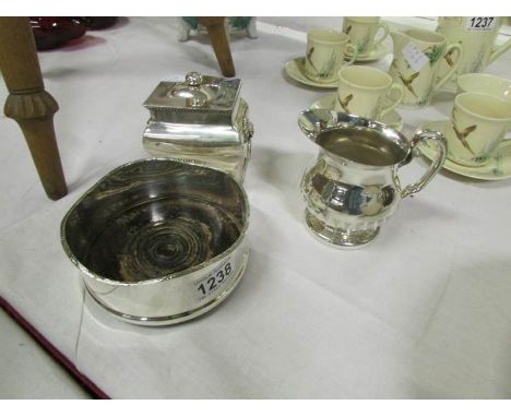 A Silver plated tea caddy, wine coaster and jug