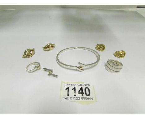A matching silver bangle, pendant and ring, another silver ring and 2 pairs of yellow metal earrings