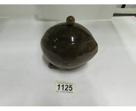A polished coconut shell tea caddy