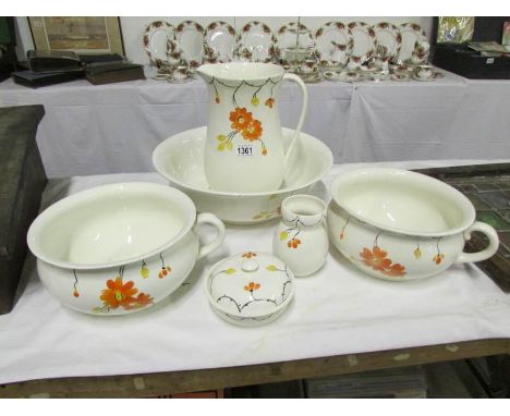 A jug and basin set with matching chamber pots, soap dish and toothbrush jar
