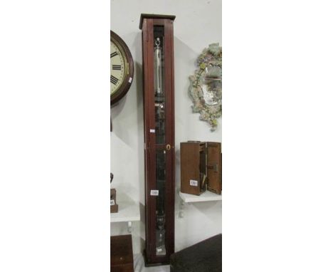 A large stick barometer in mahognay case by F Darton & Co.' Ltd., Watford