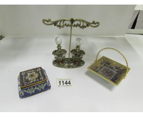 A pair of ornate perfume bottles on stand, a porcelain basket and a trinket box