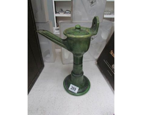 An Arabic ceramic wick lamp