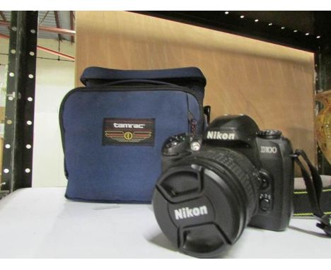 A Nikon D100 camera with case