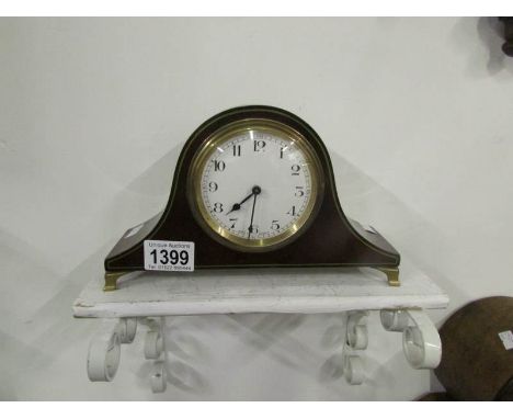 A mahogany mantel clock