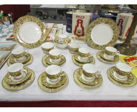 A Wedgwood floral tapestry tea set with 10 cups, 8 saucers, 8 side plates, teapot, milk jug and sugar bowl