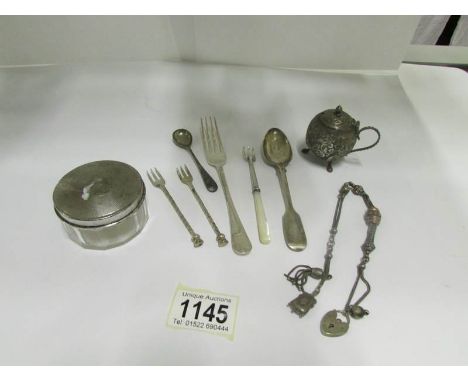 A mixed lot including silver spoons, silver topped trinket pot etc