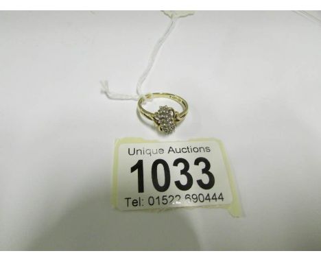 A 14kt gold and diamond ring, size R