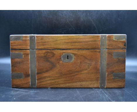 A mid 19th century walnut and brass bound writing slope, fitted interior with single glass inkwell and key. H.17 W.34 D.24cm 