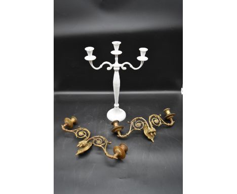 A pair of 19th century brass twin branch piano sconces along with a painted three branch table candelabra. H.42 W.30cm 