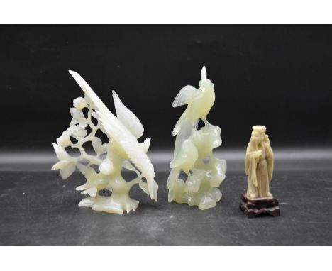 A Chinese carved soapstone standing figure along with two jade figure groups of birds. H.17cm 
