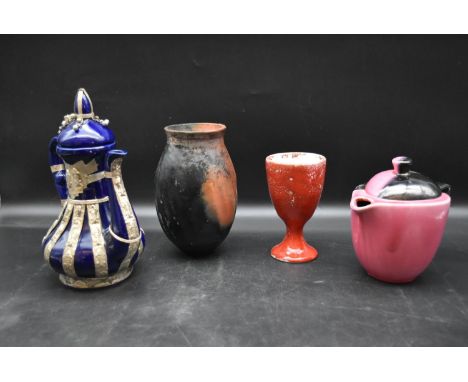 An eastern tea pot with metal mounts, a vintage coffee pot and two pieces of art pottery, both signed. H.18cm 
