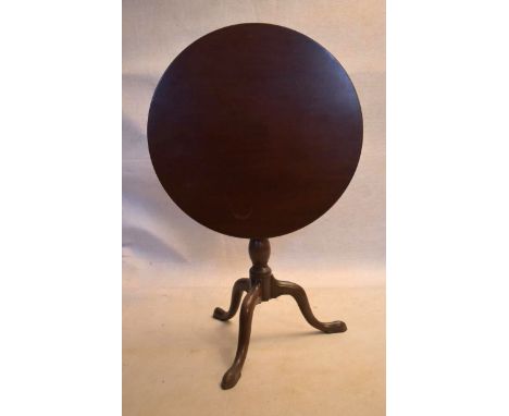 A Georgian mahogany tilt top table with bird cage action above baluster turned pedestal on tripod cabriole supports. H.70 Dia